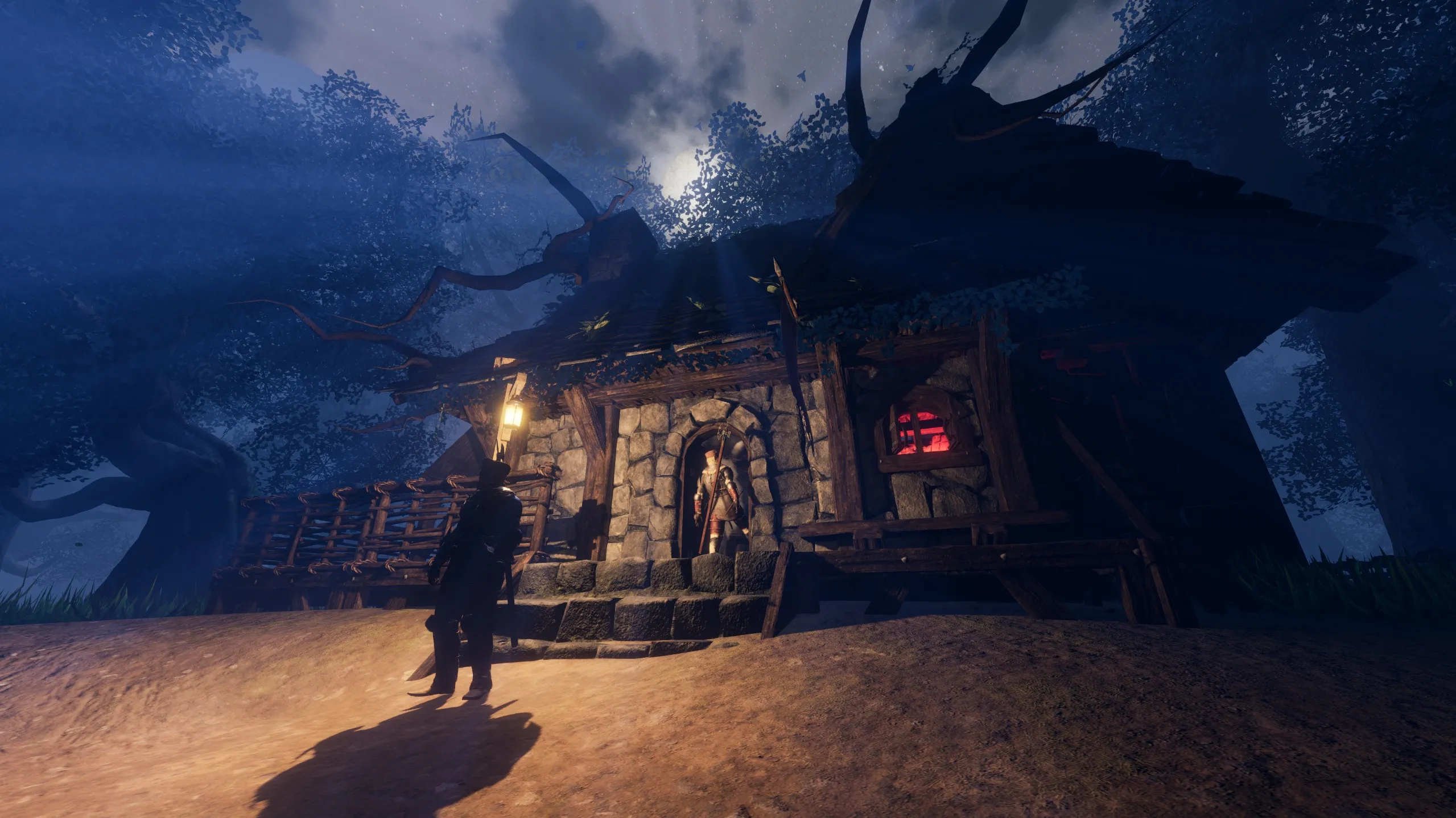 An Inquisition guard standing in the doorway of the witch's house at night